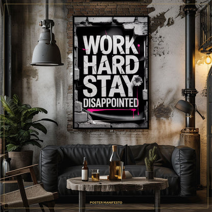 Living room with a motivational poster on the wall, a couch, and a coffee table.
