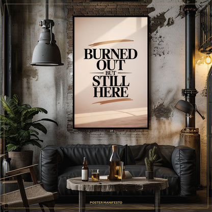 Living room with a black leather sofa, wooden coffee table, and 'Burned Out But Still Here' poster.