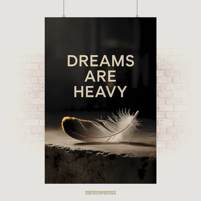 Minimalist poster reading “Dreams Are Heavy” with feather on stone surface in soft lighting