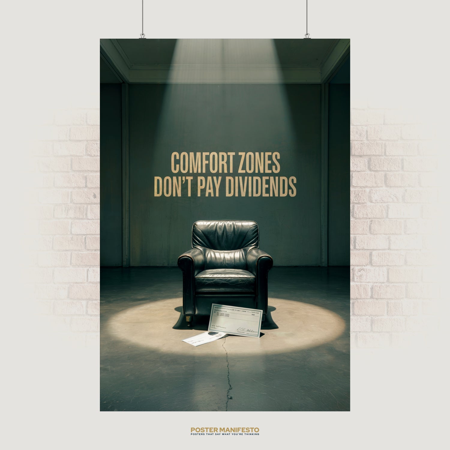 Motivational wall art with phrase “Comfort Zones Don’t Pay Dividends” above a leather chair spotlighted with million-dollar checks on the floor.