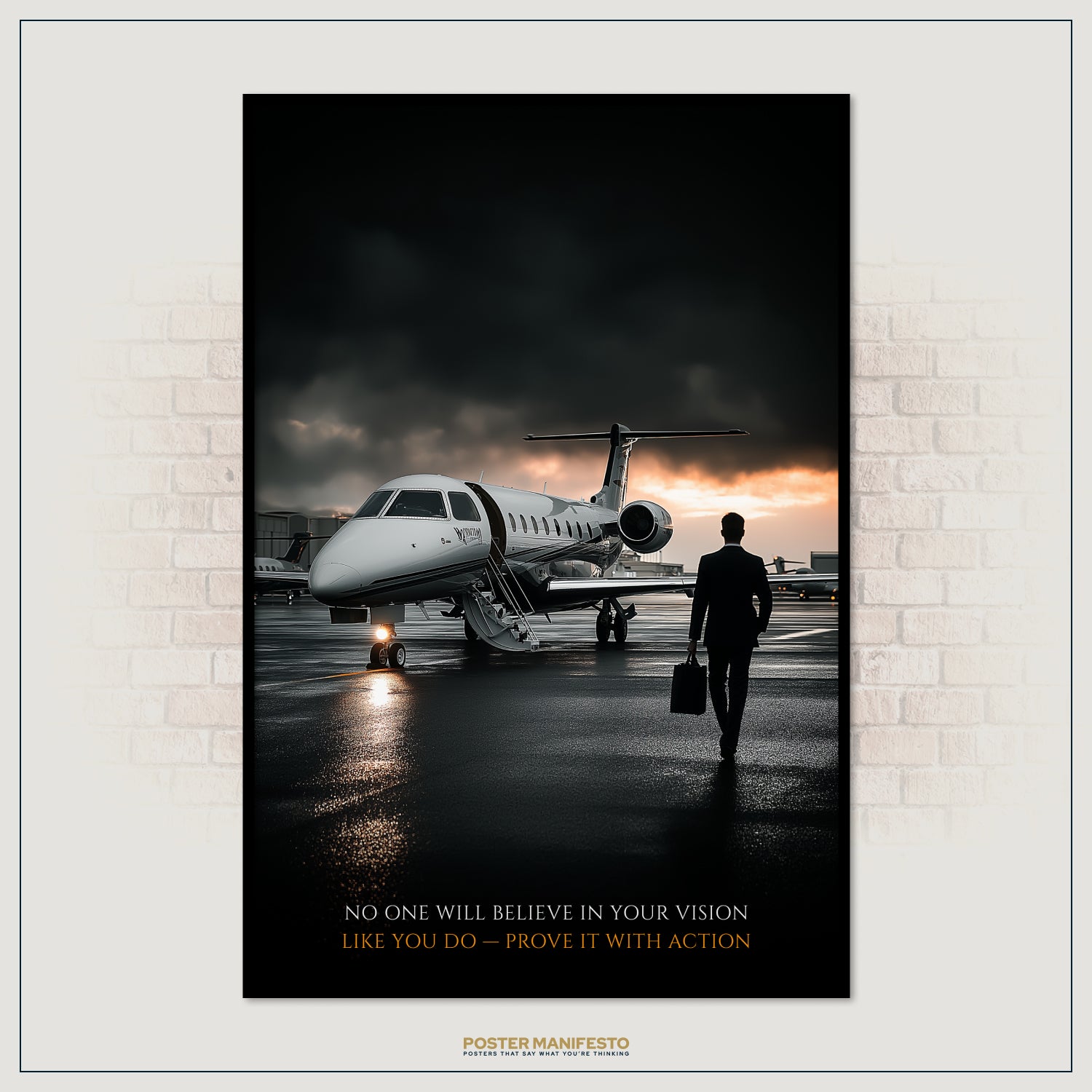 Poster of a private jet on a runway with a motivational quote, framed against a brick wall.