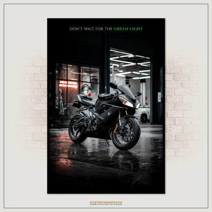 Poster of a black motorcycle in a showroom with text 'Don't Wait for the Green Light' on a brick wall background.