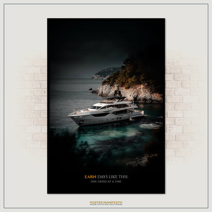 Framed poster of a yacht on the water with a mountainous island in the background, displayed on a brick wall.
