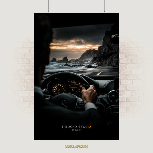 Motivational poster of a man driving a luxury car along a coastal road at sunset with the quote “The road is yours – drive it.”
