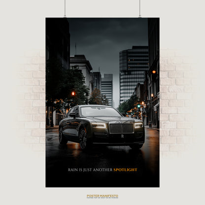 Motivational poster of a Rolls-Royce on a rainy city street with the quote “Rain is just another spotlight.”