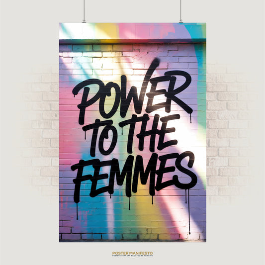 Graffiti text “Power to the Femmes” on pastel spray-painted brick wall