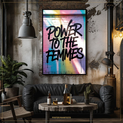 Living room with a 'Power to the Femmes' poster on the wall, a black sofa, and a small table with drinks.