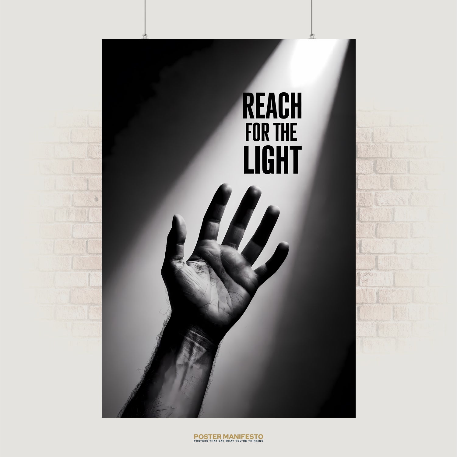 Black and white photo of a hand reaching toward a beam of light with text “Reach for the Light”
