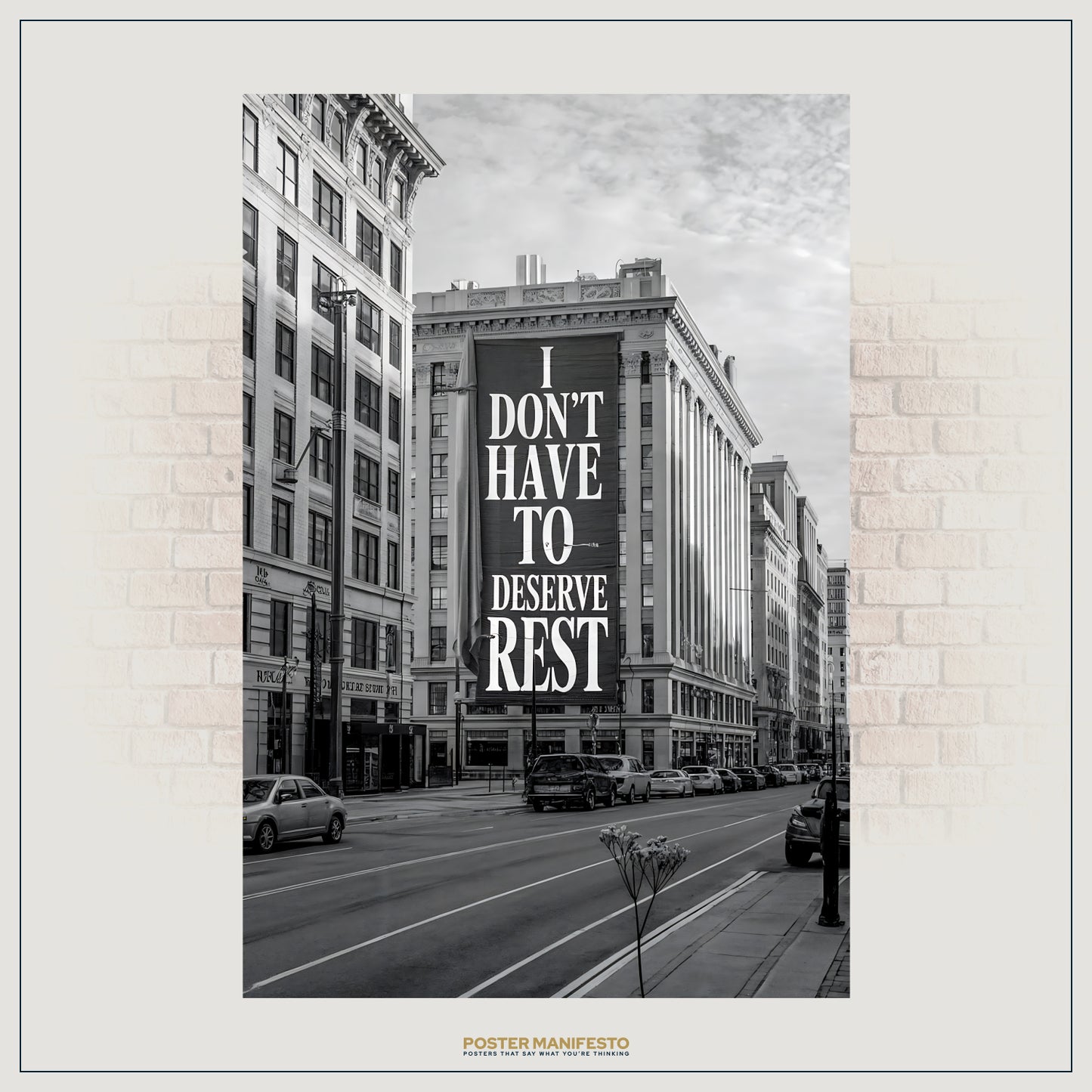 City street with a large billboard displaying the text 'I Don't Have To Deserve Rest' on a building facade.