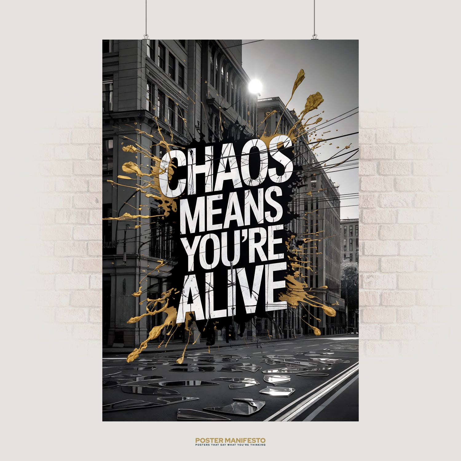 Urban street art poster with “Chaos Means You’re Alive” and gold paint splashes