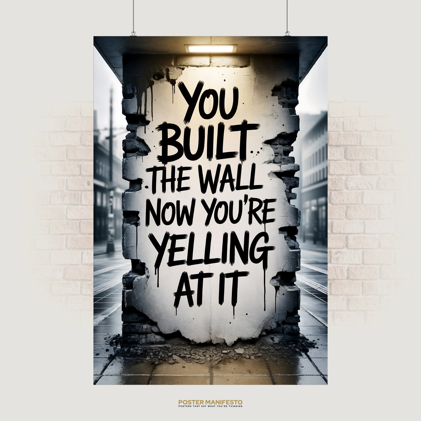 Realistic urban street art showing bold black graffiti on a crumbling wall with the phrase “You Built The Wall. Now You’re Yelling At It,” set in a moody city street scene.