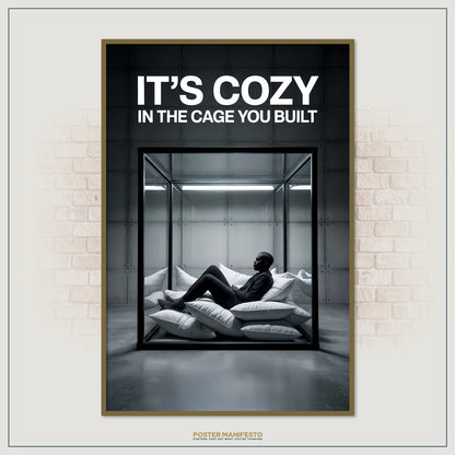 Contemporary art print illustrating comfort within confinement, featuring a man resting inside a transparent cage with the phrase “It’s Cozy In The Cage You Built.”