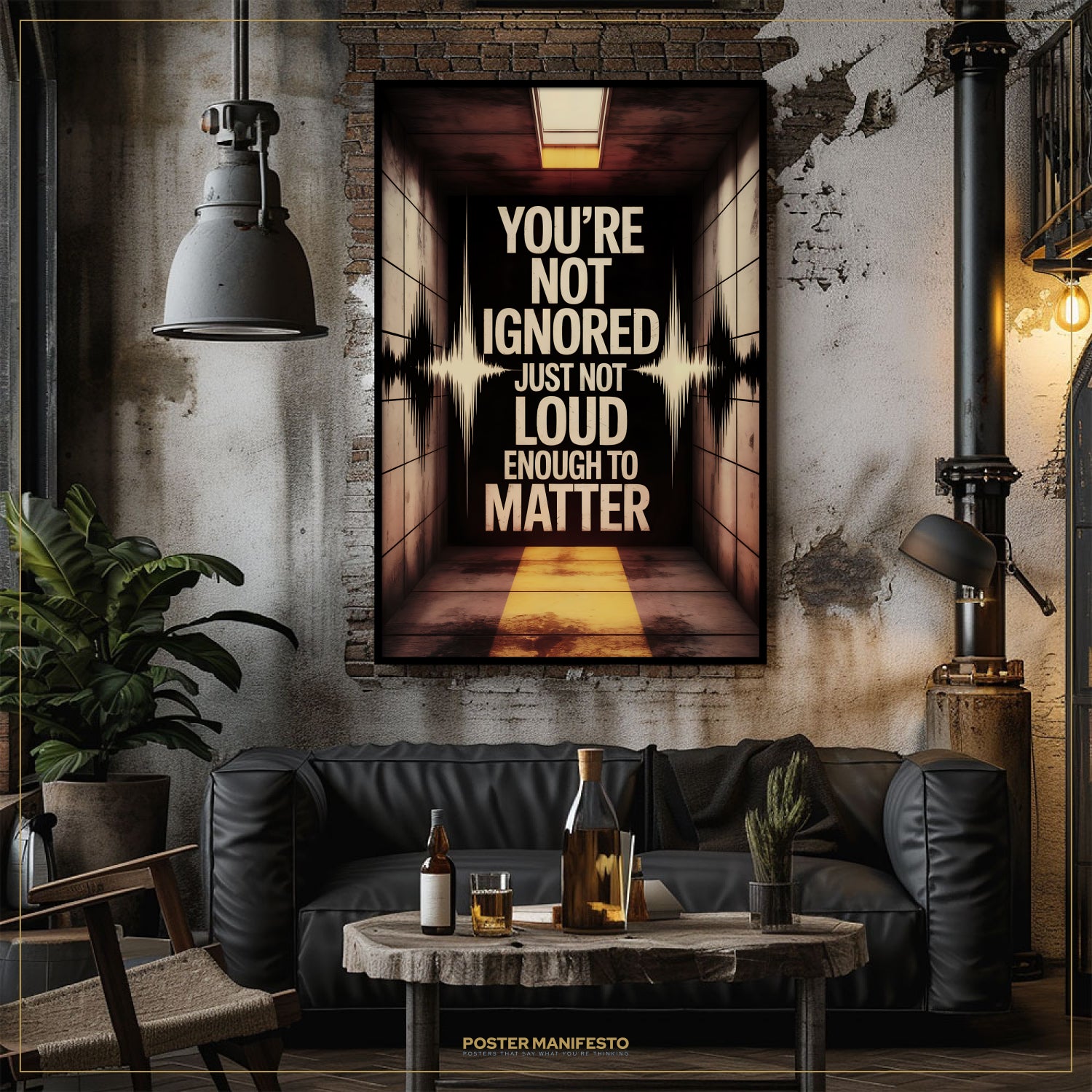Living room with a dark couch, coffee table, and motivational poster on the wall.