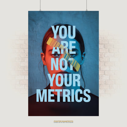 Modern poster of a woman’s face in blue and red tones, with a yellow barcode across her eyes and large text reading “You Are Not Your Metrics.”