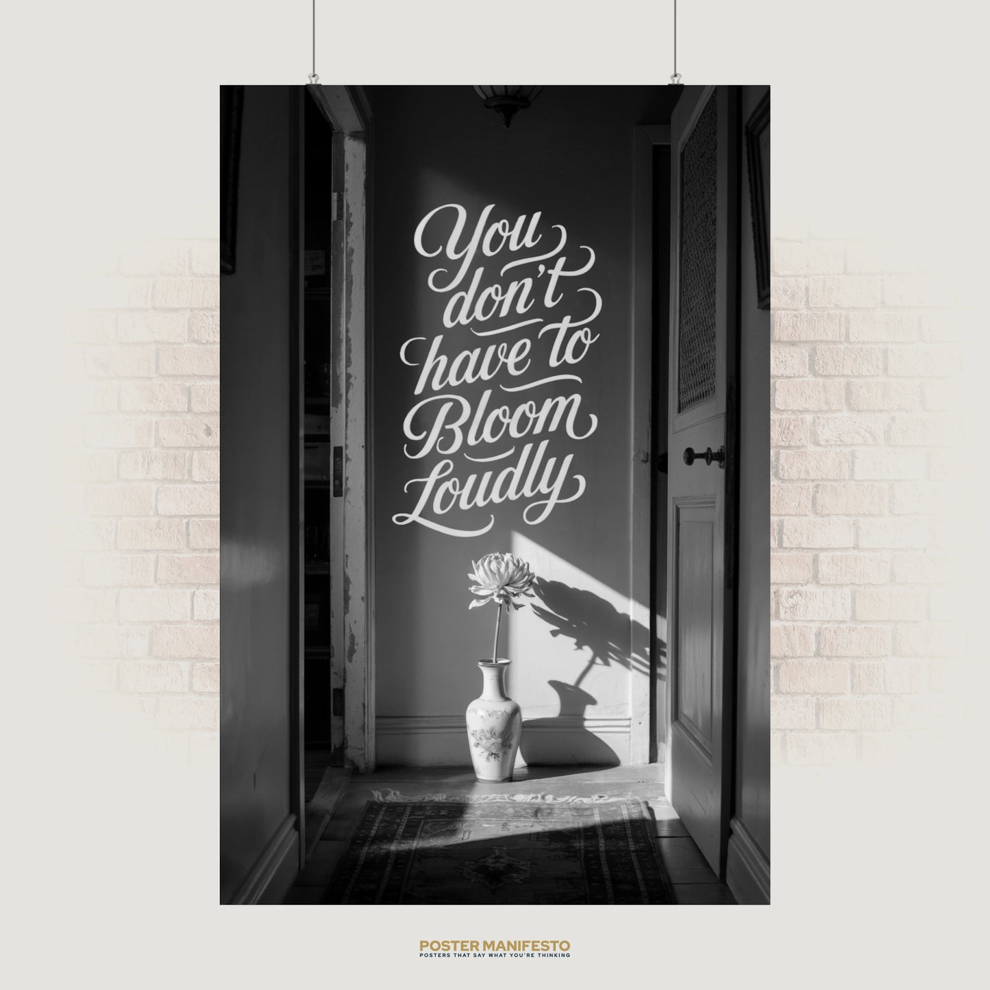 Black and white motivational poster with the quote “You Don’t Have to Bloom Loudly” above a vase with a single flower casting a shadow.