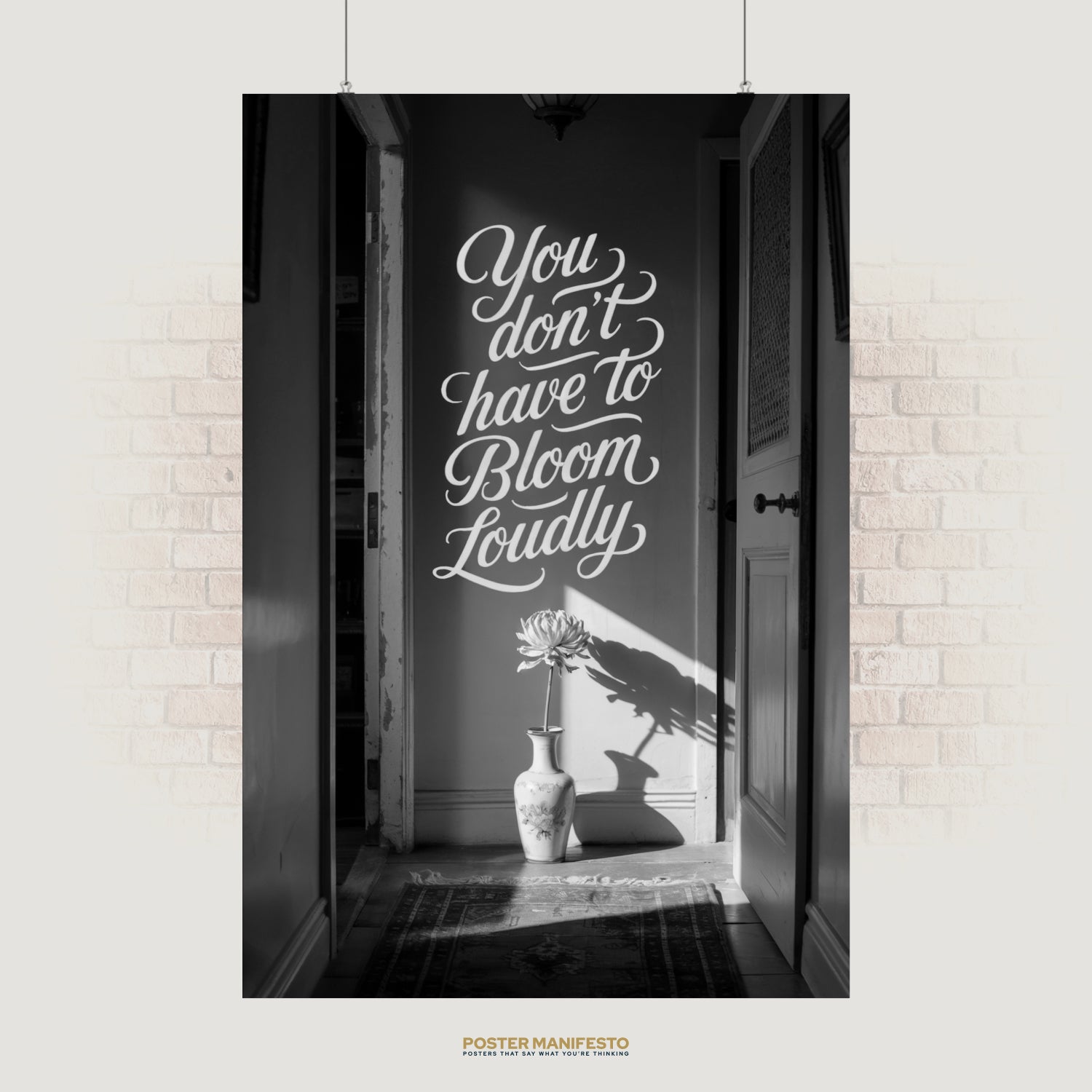 Black and white motivational poster with the quote “You Don’t Have to Bloom Loudly” above a vase with a single flower casting a shadow.