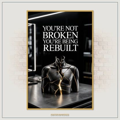 Black and gold motivational poster highlighting strength through rebuilding and transformation.