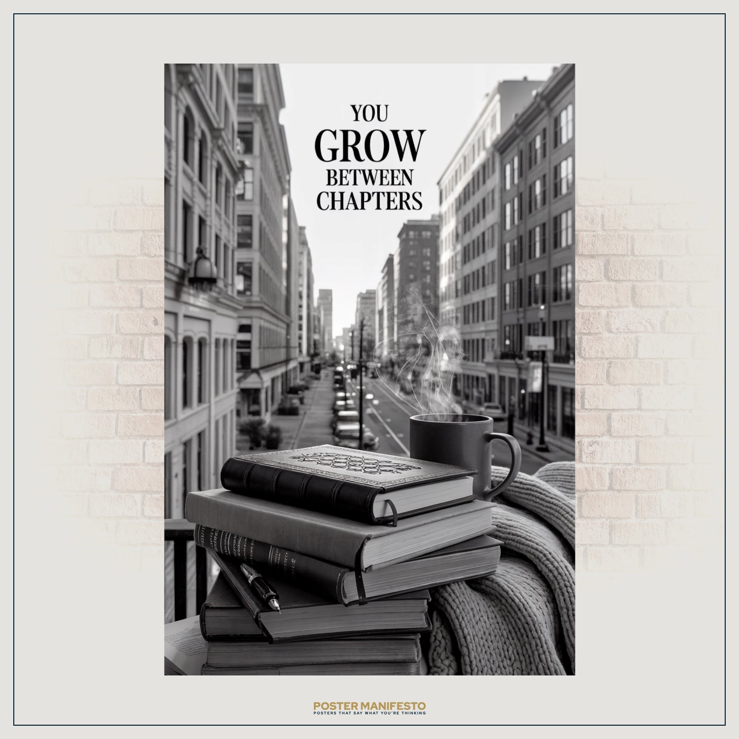 Black-and-white inspirational wall art featuring books, coffee, and cozy blanket in an urban scene.