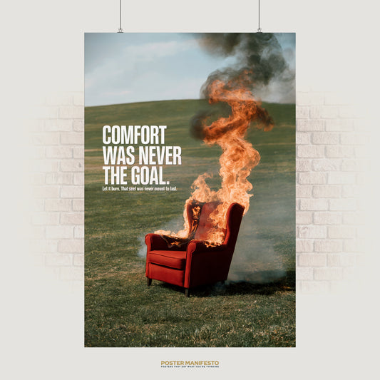 Motivational wall art poster showing a red armchair on fire in the middle of a field with bold text that reads Comfort Was Never The Goal symbolizing ambition and sacrifice.