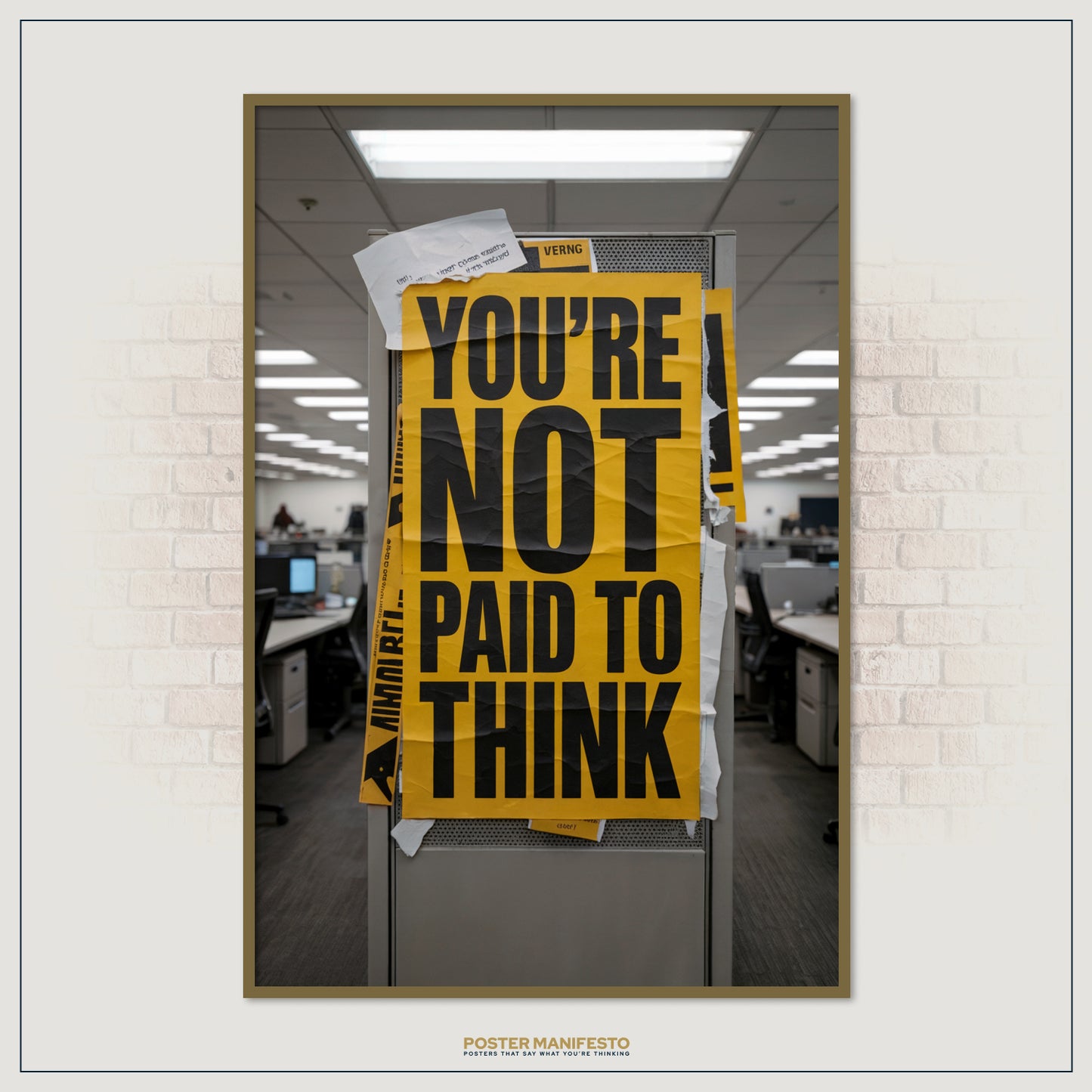 Large motivational-style office print with bold ironic text displayed in a cubicle setting.