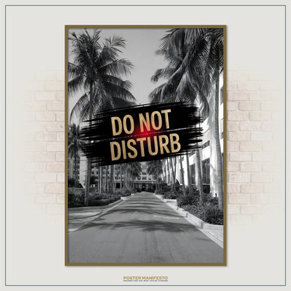 Poster with 'Do Not Disturb' text over a palm tree-lined street, framed against a brick wall.